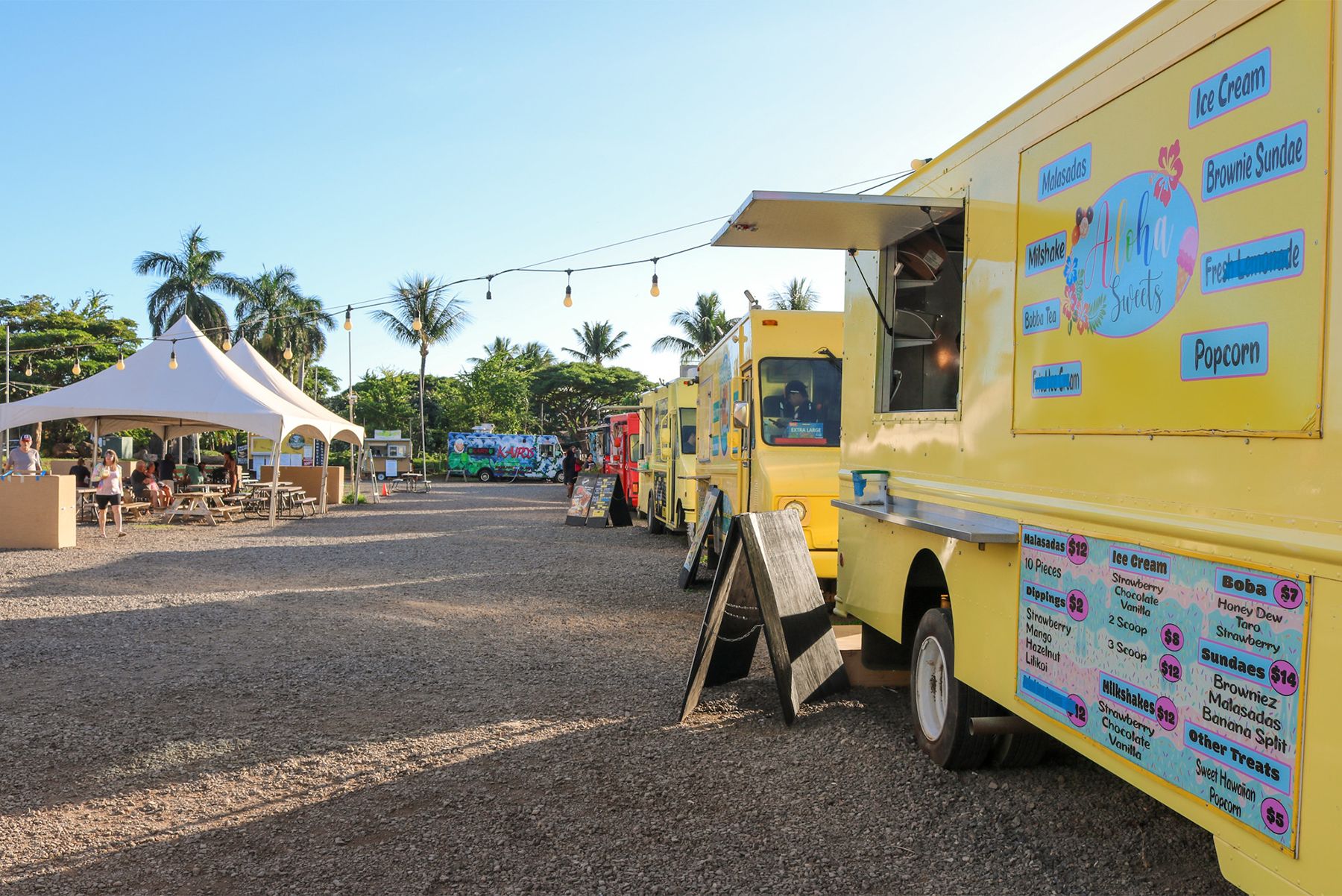 Evening food truck scene at Honoapiilani Food Truck Park