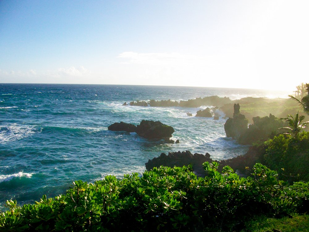 Waves breaking against lava formations along Waiʻānapanapa’s coast